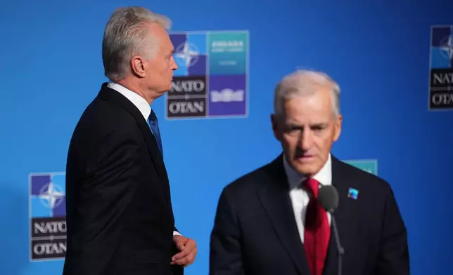 Norway's Prime Minister Jonas Gahr Store, right, speaks with the media as Lithuania's President Gitanas Nauseda, left, arrives for the NATO summit in Ankara, Turkey, Wednesday, July 8, 2026. (AP Photo/Emrah Gurel)