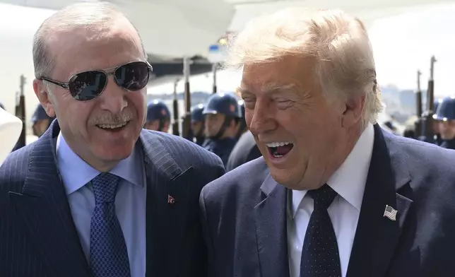 President Donald Trump, right, speaks with Turkish President Recep Tayyip Erdogan as he arrives for the NATO summit in Ankara, Turkey, Tuesday, July 7, 2026. (Doğukan Keskinkılıç, Pool Photo via AP)