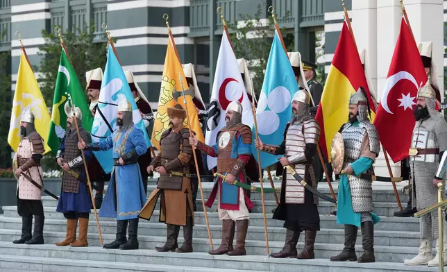 Members of the Historical Honor Guard stand before the welcoming ceremony for President Donald Trump at the Bestepe Presidential Palace during the NATO summit in Ankara, Turkey, Tuesday, July 7, 2026.(AP Photo/Alex Brandon)