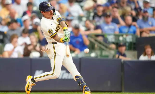 Milwaukee Brewers' Joey Ortiz hits a ground-rule double during the sixth inning of a baseball game against the New York Mets Wednesday, July 22, 2026, in Milwaukee. (AP Photo/Kayla Wolf)