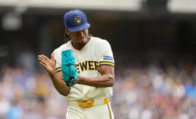Milwaukee Brewers pitcher Abner Uribe reacts to the final out of the eighth inning made by second baseman Brice Turang in a baseball game against the New York Mets Wednesday, July 22, 2026, in Milwaukee. (AP Photo/Kayla Wolf)