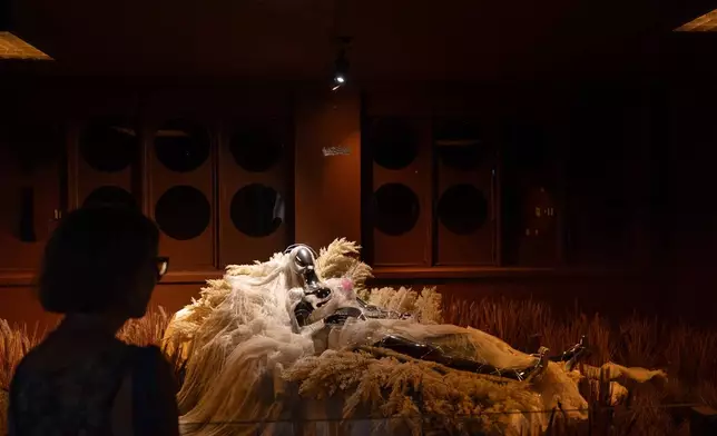 A visitor views an installation by Oshri Elmorich and Krisia KIKI Powell during the "Hospital of Emotions" exhibition inside a former hospital building in Los Angeles, Wednesday, July 22, 2026. (AP Photo/Jae C. Hong)