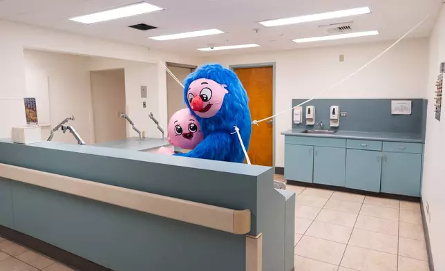 An installation is displayed at a former nurses' station in the Compassion Department during the "Hospital of Emotions" exhibition inside a former hospital building in Los Angeles, Wednesday, July 22, 2026. (AP Photo/Jae C. Hong)