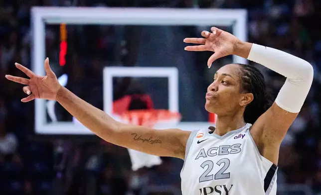Las Vegas Aces' A'ja Wilson (22) reacts after scoring against the Toronto Tempo during the second half of a WNBA basketball game in Toronto, on Monday, July 20, 2026. (Sammy Kogan/The Canadian Press via AP)