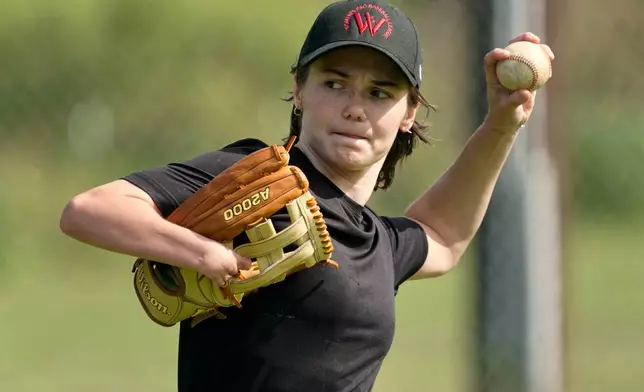 Brittany Apgar, who was born without a right hand, practices at a field in Greensboro, N.C., Wednesday, July 22, 2026 before joining the Los Angeles team in the Women's Pro Baseball League. (AP Photo/Chuck Burton)
