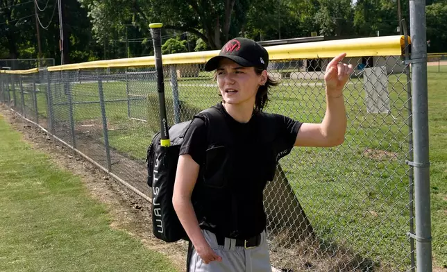 Brittany Apgar, who was born without a right hand, leaves a field in Greensboro, N.C., after practice Wednesday, July 22, 2026 before joining the Los Angeles team in the Women's Pro Baseball League. (AP Photo/Chuck Burton)