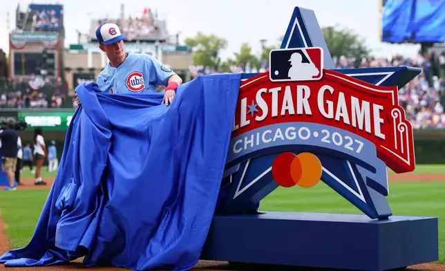 Chicago Cubs' Pete Crow-Armstrong reveals the 2027 MLB All-Star Game logo before a baseball game against the Minnesota Twins in Chicago, Friday, July 17, 2026. (AP Photo/Jessie Alcheh)