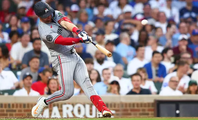 Minnesota Twins' Ryan Jeffers hits a home run during the third inning of a baseball game against the Chicago Cubs in Chicago, Friday, July 17, 2026. (AP Photo/Jessie Alcheh)