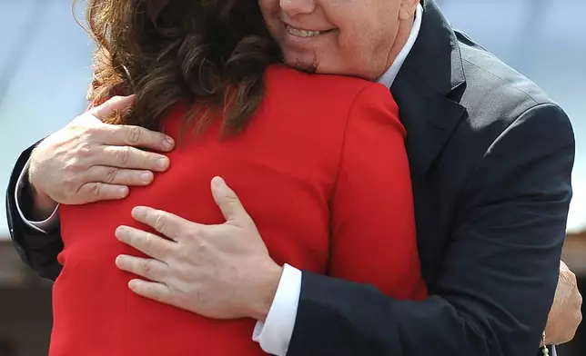 FILE - Sen. Lindsey Graham, R-S.C., right, hugs his sister Darline Graham Nordone, after announcing his bid for presidency, June 1, 2015, in Central, S.C. (AP Photo/Rainier Ehrhardt, File)
