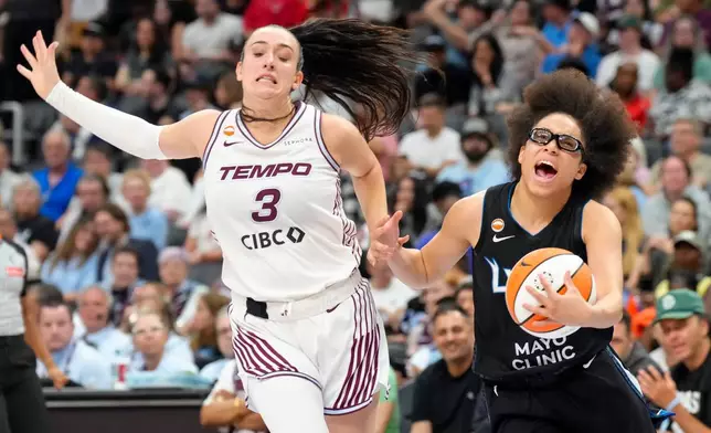Minnesota Lynx Olivia Miles (5) Toronto Tempo Marina Mabrey (3) vie for the ball during first half of a WNBA basketball game in Toronto on Thursday, July 30, 2026. (Chris Young/The Canadian Press via AP)