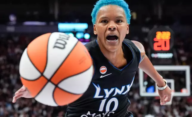 Minnesota Lynx guard Courtney Williams (10) reaches for a loose ball during first half of a WNBA basketball game in Toronto on Thursday, July 30, 2026. (Chris Young/The Canadian Press via AP)