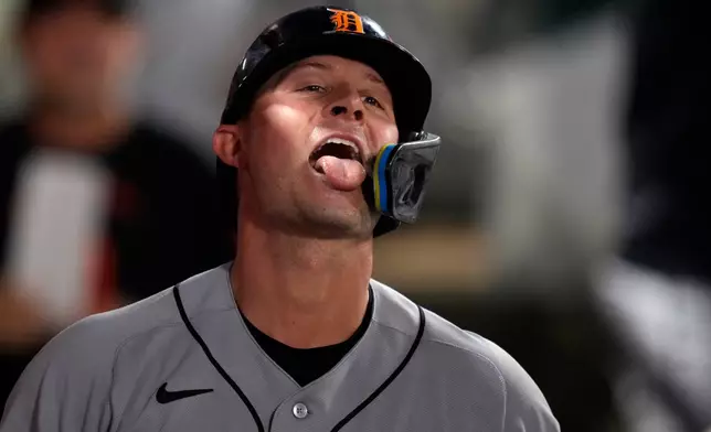 Detroit Tigers' Spencer Torkelson sticks his tongue out as seeds are thrown at him in the dugout after hitting a solo home run during the fifth inning of a baseball game against the Los Angeles Angels, Saturday, July 18, 2026, in Anaheim, Calif. (AP Photo/Mark J. Terrill)