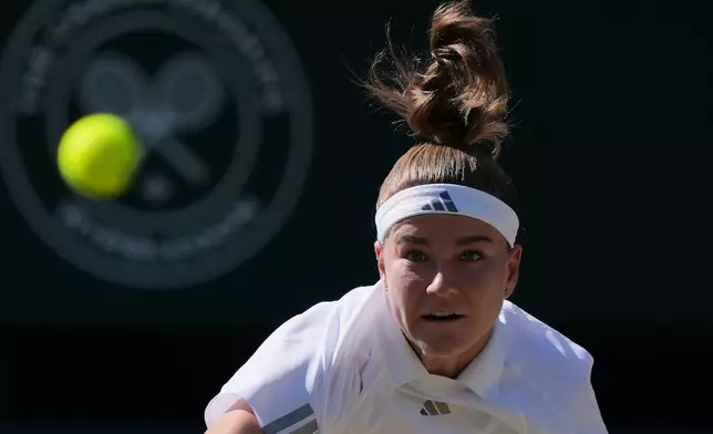 Karolina Muchova of Czech Republic serves to Linda Noskova of Czech Republic in the women's singles final at Wimbledon Tennis Championships in London, Saturday, July 11, 2026. (AP Photo/Kin Cheung)