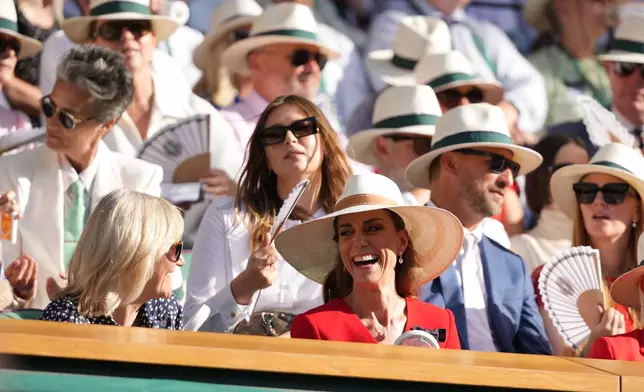 Britain's Princess Kate laughs in the royal box as she attends the women's singles final between Linda Noskova of Czech Republic and Karolina Muchova of Czech Republic at Wimbledon Tennis Championships in London, Saturday, July 11, 2026. (AP Photo/Kirsty Wigglesworth)