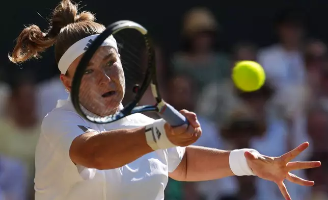 Karolina Muchova of Czech Republic returns the ball to Linda Noskova of Czech Republic in the women's singles final at Wimbledon Tennis Championships in London, Saturday, July 11, 2026. (AP Photo/Kirsty Wigglesworth)