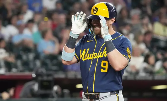 Milwaukee Brewers' Jake Bauers reacts after hitting a two-run home run against the Arizona Diamondbacks in the seventh inning of a baseball game, Sunday, July 5, 2026, in Phoenix. (AP Photo/Rick Scuteri)