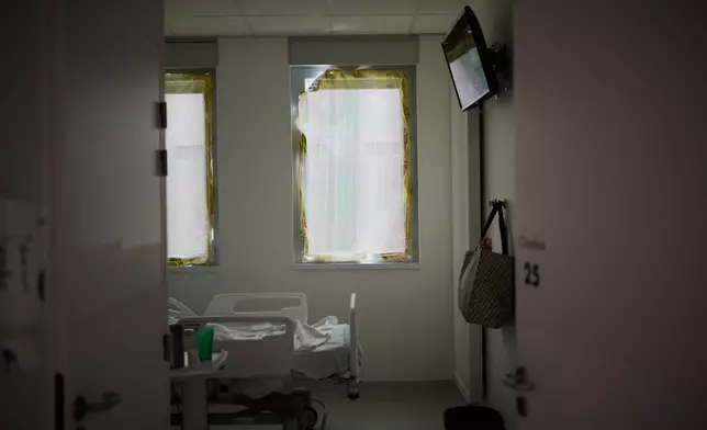 A heat-protection is set on a window at the emergency department of the Paris-Saclay Hospital, outside Paris, Tuesday June 30, 2026. (AP Photo/Christophe Ena )