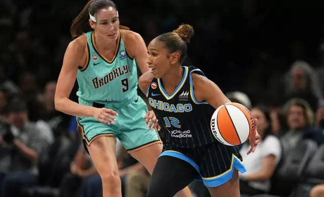New York Liberty's Rebecca Allen, left, defends Chicago Sky's Sydney Taylor during the second half of a WNBA basketball game Wednesday, July 22, 2026, in New York. (AP Photo/Frank Franklin II)