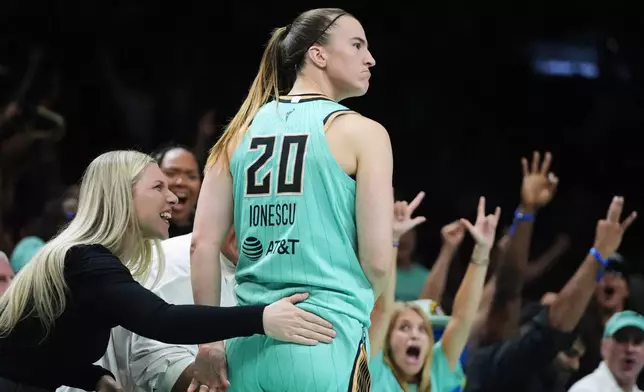 New York Liberty's Sabrina Ionescu (20) reacts after making a three-point shot during the second half of a WNBA basketball game against the Chicago Sky Wednesday, July 22, 2026, in New York. (AP Photo/Frank Franklin II)