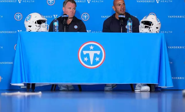 Tennessee Titans general manager Mike Borgonzi, left, and head coach Robert Saleh, right, respond to questions during a news conference at the NFL football team's training camp Tuesday, July 28, 2026, in Nashville, Tenn. (AP Photo/George Walker IV)