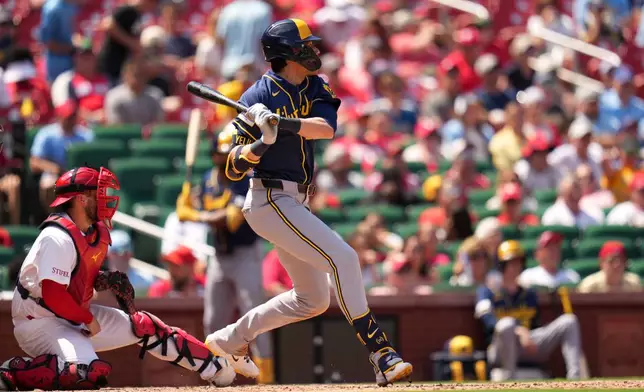 Milwaukee Brewers' Christian Yelich watches his RBI double during the seventh inning in the first game of a baseball doubleheader against the St. Louis Cardinals Tuesday, July 7, 2026, in St. Louis. (AP Photo/Jeff Roberson)