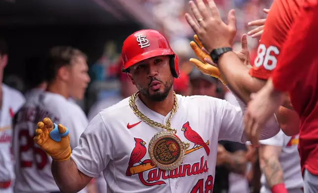 St. Louis Cardinals' Iván Herrera is congratulated by teammates after hitting a solo home run during the third inning in the first game of a baseball doubleheader against the Milwaukee Brewers Tuesday, July 7, 2026, in St. Louis. (AP Photo/Jeff Roberson)
