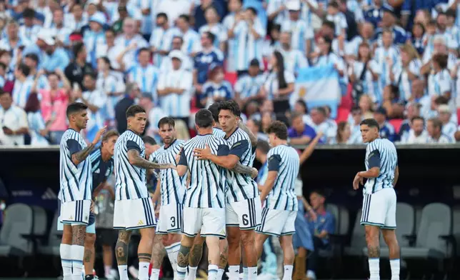 Players of Argentina warm up prior to the World Cup quarterfinal soccer match against Switzerland in Kansas City, Mo., Saturday, July 11, 2026. (AP Photo/Jeff Roberson)