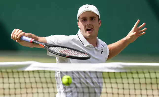 Arthur Fery of Britain plays a volley against Alexander Zverev of Germany in their men's singles semifinal match at the Wimbledon Tennis Championships in London, Friday, July 10, 2026. (AP Photo/Brian Inganga)