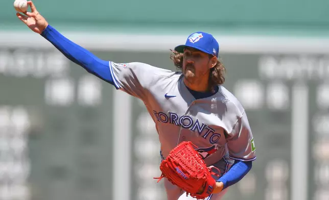 Toronto Blue Jays' Kevin Gausman delivers a pitch to a Boston Red Sox batter in the first inning of a baseball game, Sunday, July 26, 2026, in Boston. (AP Photo/Steven Senne)