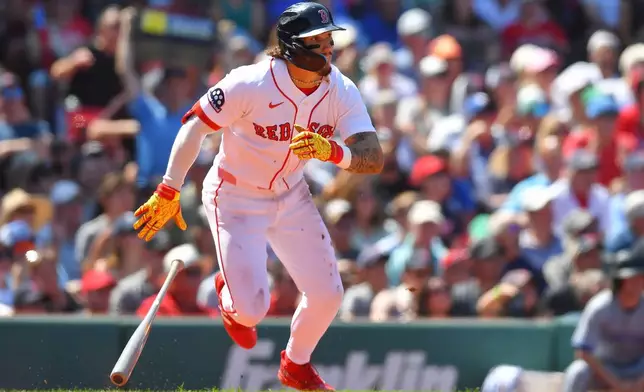 Boston Red Sox's Jarren Duran runs toward first base after hitting a two-run single in the fourth inning of a baseball game against the Toronto Blue Jays, Sunday, July 26, 2026, in Boston. (AP Photo/Steven Senne)
