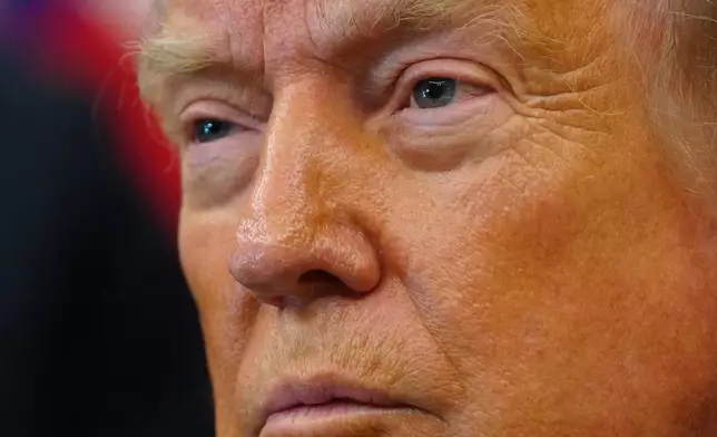 President Donald Trump listens after signing executive orders modifying the Bears Ears National Monument and the Grand Staircase-Escalante National Monument in the Oval Office of the White House, Monday, July 13, 2026, in Washington. (AP Photo/Julia Demaree Nikhinson)