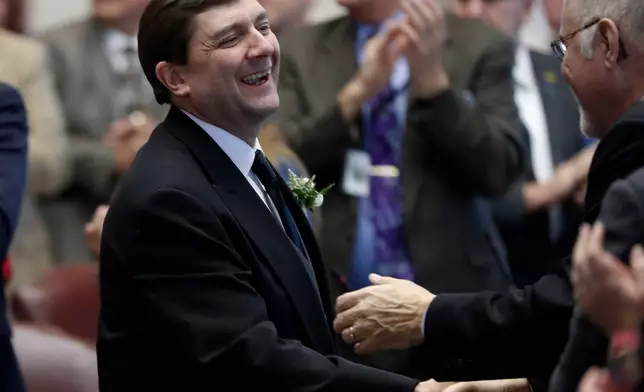 FILE - Senate President Troy Jackson, D-Allagash, is greeted by lawmakers as he arrives for joint session in the House Chamber, Wednesday, Dec., 5, 2018, at the State House in Augusta, Maine. (AP Photo/Robert F. Bukaty,File)