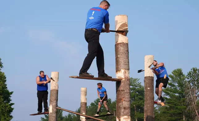 The final springboard chop event is underway during the Lumberjack World Championships, Saturday, July 18, 2026, in Hayward, Wis. (AP Photo/Ellen Schmidt)