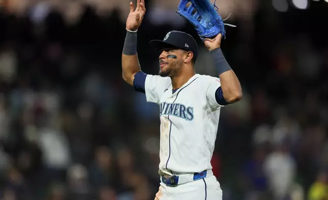 Seattle Mariners' Julio Rodríguez reacts after defeating the Los Angeles Angels in a baseball game Tuesday, June 30, 2026, in Seattle. (AP Photo/Kevin Ng)