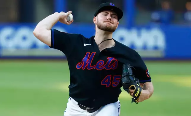 New York Mets' pitcher Christian Scott throws against the Kansas City Royals during the second inning of a baseball game, Wednesday, July 8, 2026, in New York. (AP Photo/Noah K. Murray)