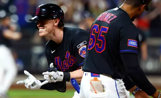 New York Mets' Brett Baty reacts after hitting an RBI single against the Kansas City Royals during the eighth inning of a baseball game, Wednesday, July 8, 2026, in New York. (AP Photo/Noah K. Murray)