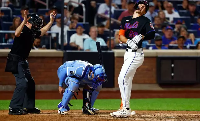 New York Mets' Jared Young reacts after being hit by a pitch during the eighth inning of a baseball game against the Kansas City Royals, Wednesday, July 8, 2026, in New York. (AP Photo/Noah K. Murray)
