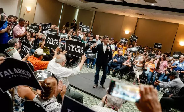 Attendees listen as Democratic Senate candidate James Talarico speaks at a rally on Monday, July 13, 2026, in Eagle Pass, Texas. (AP Photo/Brenda Bazán)
