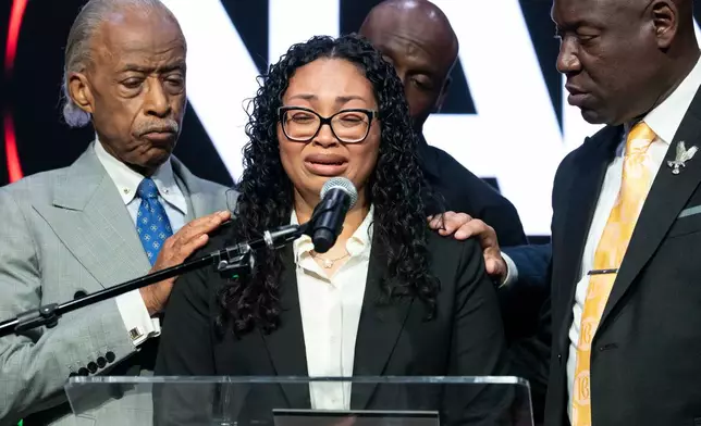 Christine Wonsley, mother of Nolan Xavier Wells, reacts as she speaks during a news conference at National Action Network headquarters, Friday, July 10, 2026, in New York. (AP Photo/Yuki Iwamura)