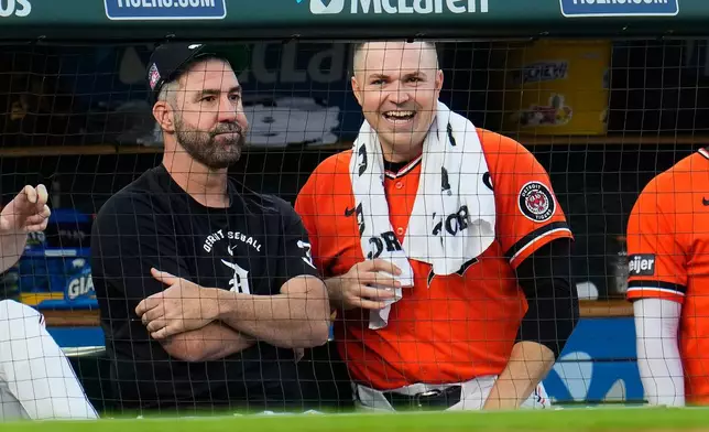 Detroit Tigers Justin Verlander, left, sits with Tarik Skubal, right, during the eighth inning of a baseball game against the Kansas City Royals Friday, July 24, 2026, in Detroit. (AP Photo/Paul Sancya)