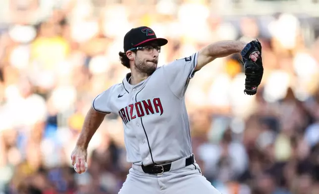 Arizona Diamondbacks pitcher Zac Gallen winds up against a San Diego Padres' batter in the first inning of a baseball game Tuesday, July 7, 2026, in San Diego. (AP Photo/Derrick Tuskan)