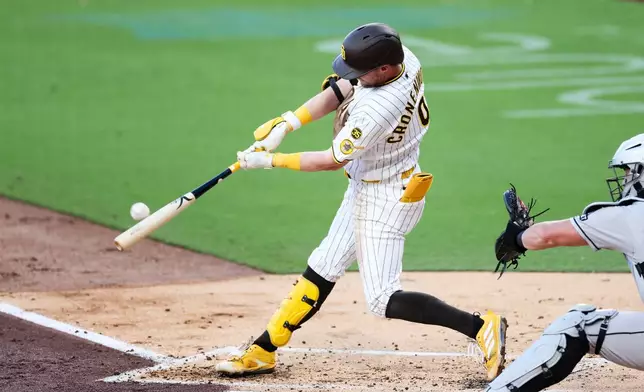 San Diego Padres' Jake Cronenworth hits a three-run home run against the Arizona Diamondbacks in the first inning of a baseball game Tuesday, July 7, 2026, in San Diego. (AP Photo/Derrick Tuskan)