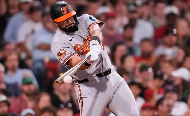 Baltimore Orioles' Christian Encarnacion-Strand connects for an RBI single in the sixth inning of a baseball game against the Boston Red Sox, Monday, July 20, 2026, in Boston. (AP Photo/Charles Krupa)