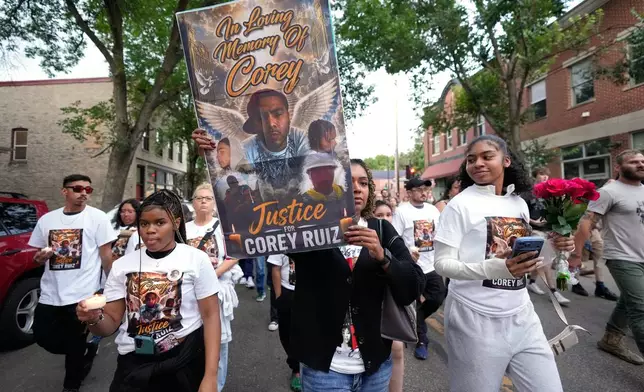 Protesters march Thursday, July 23, 2026, in Madison, Wis., after a Madison police officer shot and killed Corey Durell Ruiz on Wednesday. (AP Photo/Kayla Wolf)