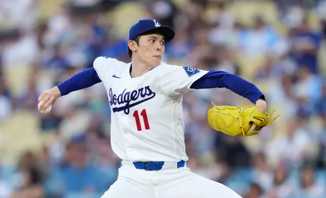 Los Angeles Dodgers starting pitcher Roki Sasaki throws to the plate during the first inning of a baseball game against the Seattle Mariners, Thursday, July 30, 2026, in Los Angeles. (AP Photo/Mark J. Terrill)