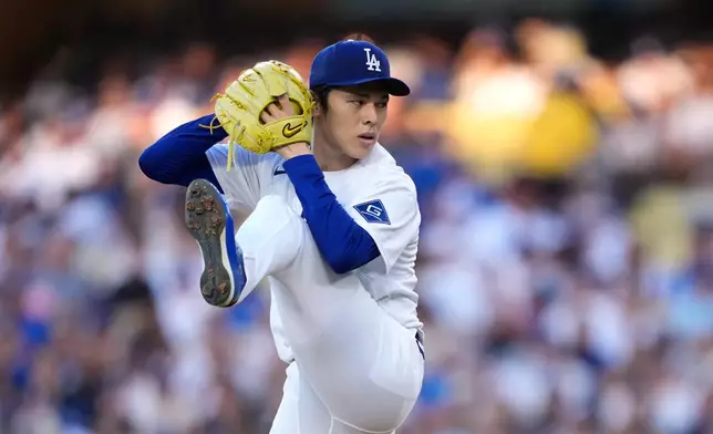 Los Angeles Dodgers starting pitcher Roki Sasaki throws to the plate during the first inning of a baseball game against the Colorado Rockies, Wednesday, July 8, 2026, in Los Angeles. (AP Photo/Mark J. Terrill)