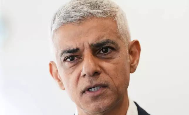 London Mayor Sadiq Khan, is interviewed after a walkabout through the borough of Camden in London, Thursday, July 23, 2026. (AP Photo/Kirsty Wigglesworth)