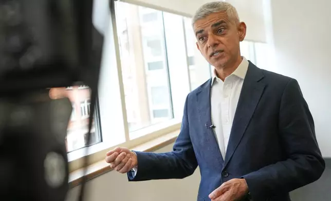 London Mayor Sadiq Khan, is interviewed after a walkabout through the borough of Camden in London, Thursday, July 23, 2026. (AP Photo/Kirsty Wigglesworth)
