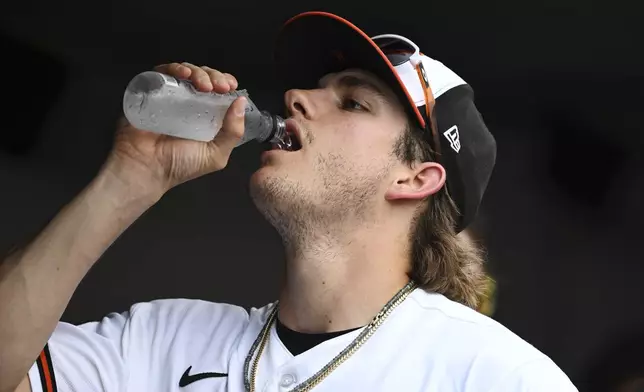 Baltimore Orioles third baseman Coby Mayo hydrates during a MLB baseball game, Wednesday, July 1, 2026 in Baltimore. (AP Photo/Gail Burton)