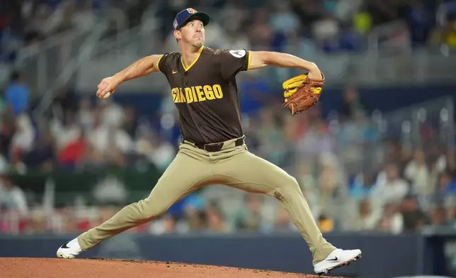 San Diego Padres starting pitcher Walker Buehler delivers during the first inning of a baseball game against the Miami Marlins, Sunday, July 26, 2026, in Miami. (AP Photo/Rebecca Blackwell)